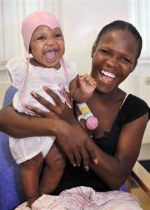 Seignon is reunited with her daughter Landina at the Chelsea and Westminster Hospital in London six months after the baby was pulled from the rubble of the Haiti earthquake.