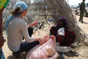 Somalia Famine 139 Amanda Lindhout, in Somalia, talks with Sameya Mohamed, who thanked her for bringing food and said, "my grandchildren are starving." (Kate Snow)
