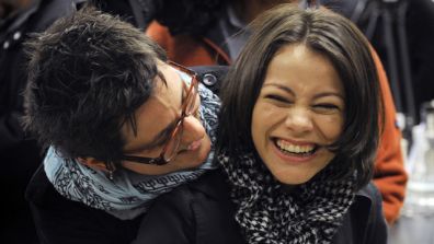 Intel Semifinalist Samantha Garvey, 17, right, gets a hug from her science research teacher, Rebecca Grella.  